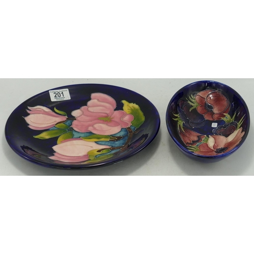 201 - Walter Moorcroft Anemone oval dish and Magnolia round plate, d.25cm. (2)