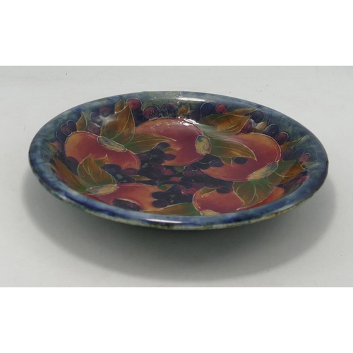 329 - Early Moorcroft Pomegranate patterned  shallow bowl, restored rim, diameter 23cm