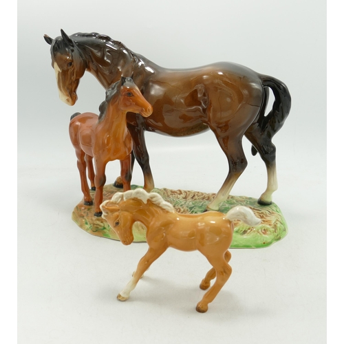 503 - Beswick model of brown Mare and chestnut Foal
953, on ceramic grassy base together with similar palo... 