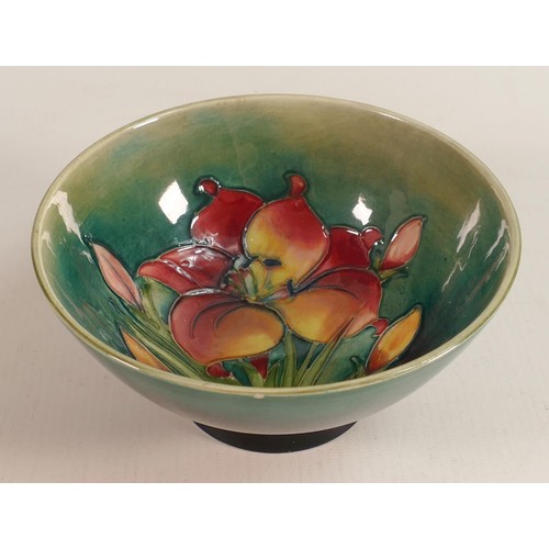 324 - Moorcroft Spring Flowers on Green Ground Footed Bowl, height 7cm, tiny chip to rim