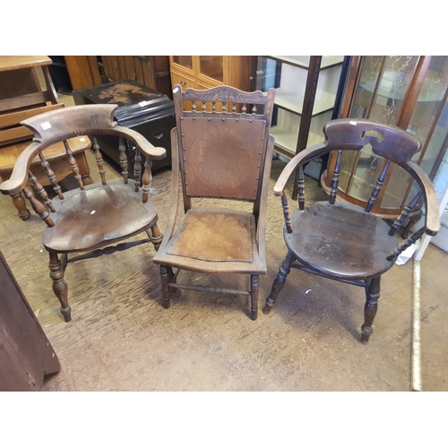 621 - Oak early 2oth century nursing chair together with two non matching captains style chairs.