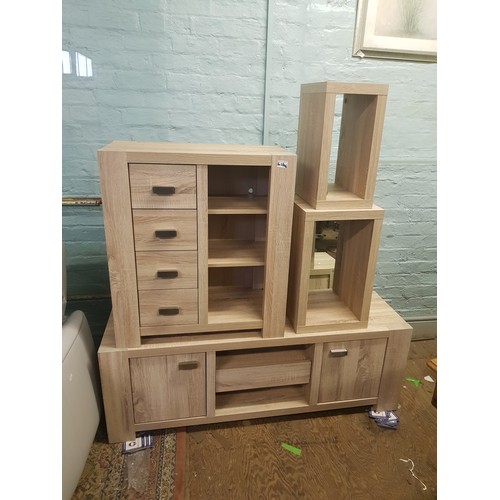 626 - Matching limed oak effect furniture items including a low sideboard, chest of drawers unit and two o... 