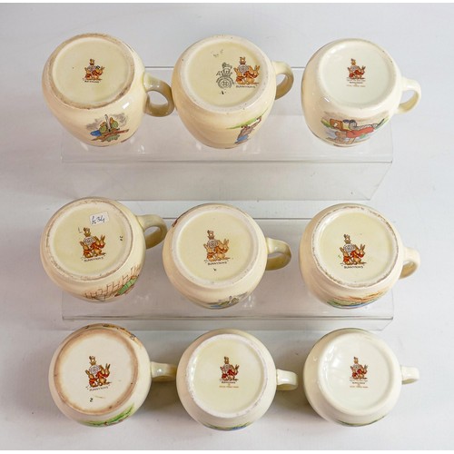 65 - Royal Doulton Bunnykins Don one handled cups, 5  Barbara Vernon pieces noted. (9)