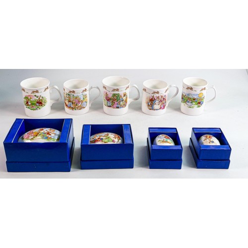 92 - Royal Doulton Bunnykins white china mugs x 5 & boxed decorative egg boxes x 4. (9)