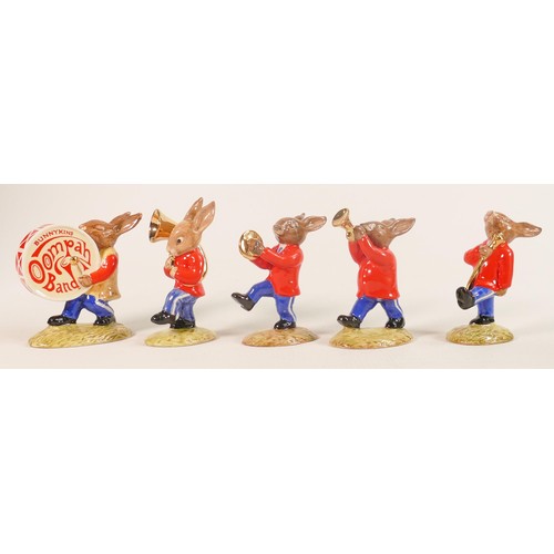 97 - A Royal Doulton rare Bunnykins Oompah band set of figures with gold highlights, comprising -Drummer ... 