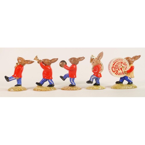 97 - A Royal Doulton rare Bunnykins Oompah band set of figures with gold highlights, comprising -Drummer ... 