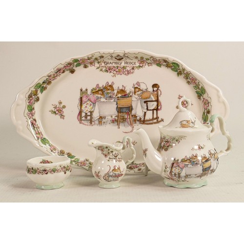 121 - Royal Doulton Brambly Hedge miniature tea service, height of tea pot 10cm. (4)