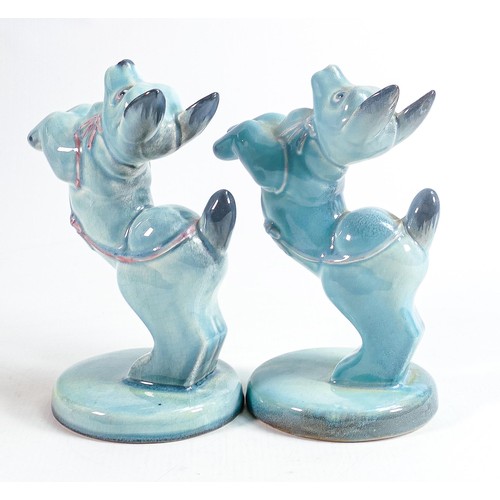 138 - Beswick blue gloss model of a character dog begging & similar with pink highlights. (2)