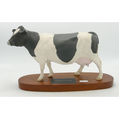 152 - Beswick Connoisseur Friesian cow model no. A2607 on a wooden plinth.