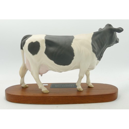 152 - Beswick Connoisseur Friesian cow model no. A2607 on a wooden plinth.