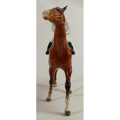 192 - Beswick Jockey on Walking Horse 1037, jockey in white, red & blue colourway, No7 detail noted on lig... 