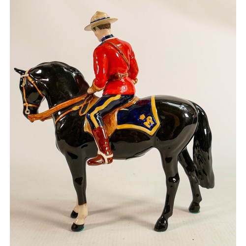 217 - Beswick Canadian Mountie policeman on black horse, restored ears.