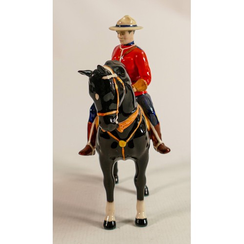 217 - Beswick Canadian Mountie policeman on black horse, restored ears.