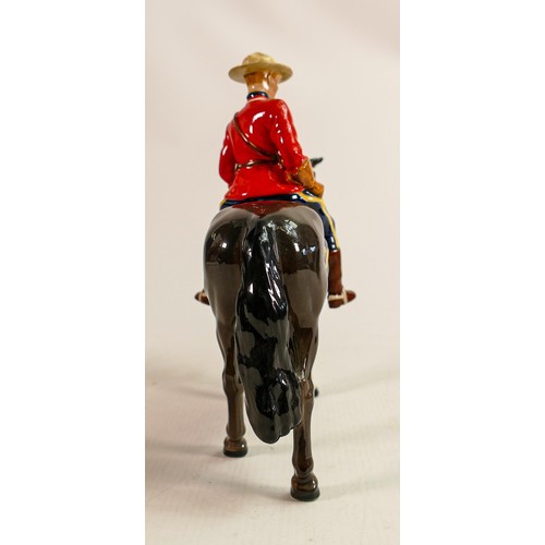 220 - Beswick Canadian Mountie policeman on charcoal horse 1375, restored horses ear & riders boot.