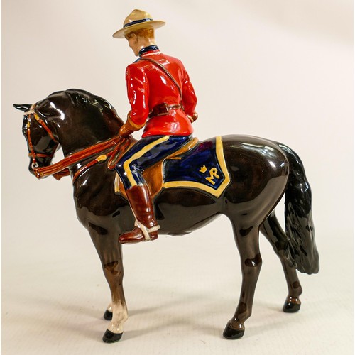 220 - Beswick Canadian Mountie policeman on charcoal horse 1375, restored horses ear & riders boot.