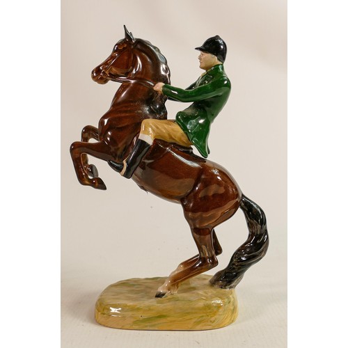 224 - Beswick Huntsman on rearing horse 868 with green jacket, restored foot on rider.