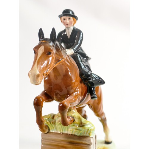 242 - Beswick model of a lady, side saddle on jumping horse 982, restored ears.