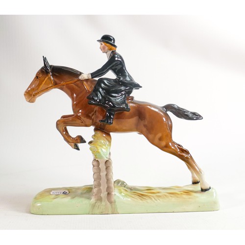 242 - Beswick model of a lady, side saddle on jumping horse 982, restored ears.