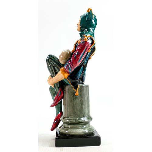 274 - Royal Doulton prototype earthenware figure of a Jester painted in a green, red and orange colourway,... 