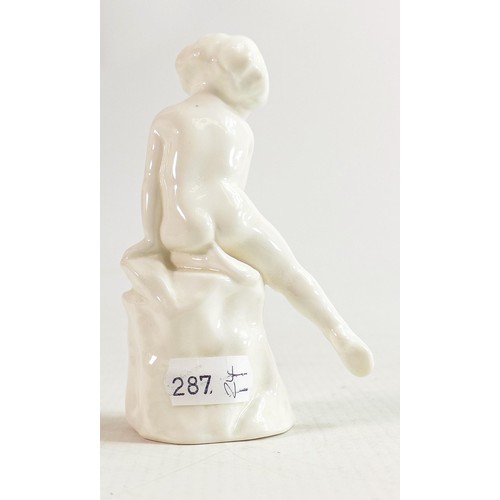 351 - Royal Doulton figure A child study in all over white glaze, C1930. h.11.5cm.