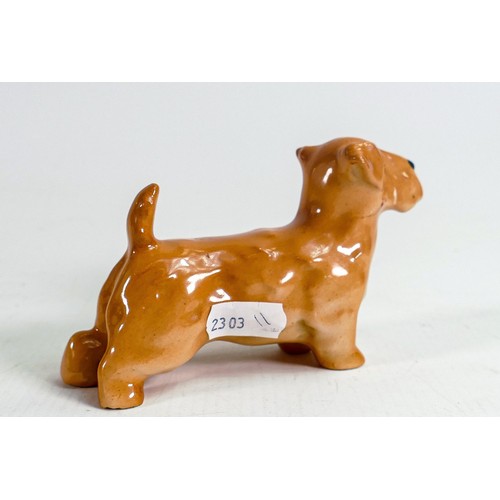 394 - Rare Royal Doulton model of a terrier dated 1938, h.7cm, hairline cracks to tail and neck area..