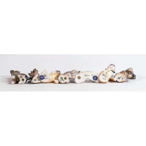 401 - A collection of Royal Doulton small dogs to include  - laying Bull terrier K14, begging Scottish ter... 