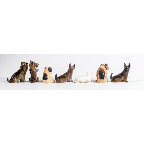 401 - A collection of Royal Doulton small dogs to include  - laying Bull terrier K14, begging Scottish ter... 