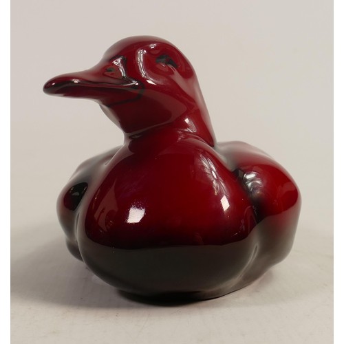 411 - Royal Doulton Flambe model of a nestling drake, signed by Noke, L.18 x h.9cm.