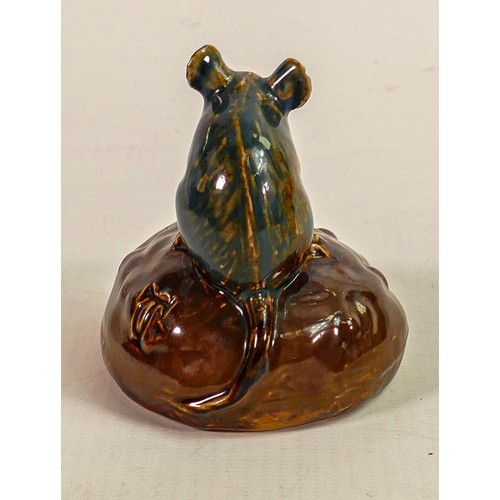 416 - George Tinworth for Doulton Lambeth, a mouse seated on a bun holding a raisin, in a brown and blue c... 