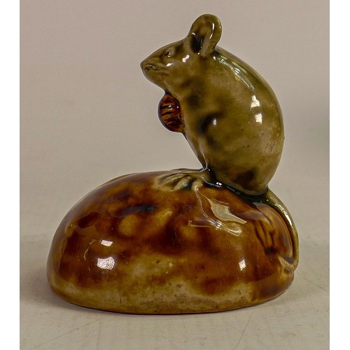 430 - George Tinworth for Doulton Lambeth, A mouse seated on a bun holding a raisin, in a green and brown ... 