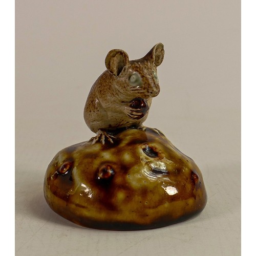 433 - George Tinworth for Doulton Lambeth, a mouse seated on a bun holding a raisin, in a two tone brown c... 