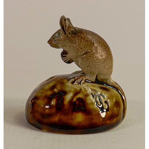 433 - George Tinworth for Doulton Lambeth, a mouse seated on a bun holding a raisin, in a two tone brown c... 