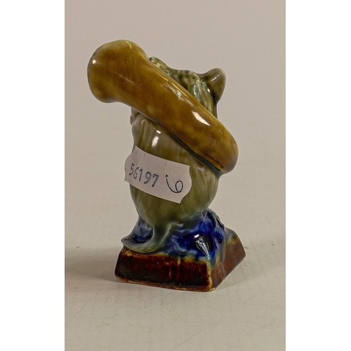 436 - George Tinworth for Doulton Lambeth, A comical figure of a mouse playing a trombone, in a two tone b... 