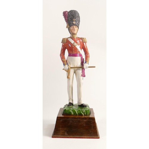 699 - Sitzendorf porcelain figure of a Coldstream Guard 1832 soldier, on wood plinth, overall height 33cm.