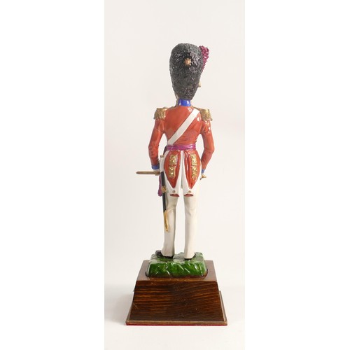 699 - Sitzendorf porcelain figure of a Coldstream Guard 1832 soldier, on wood plinth, overall height 33cm.