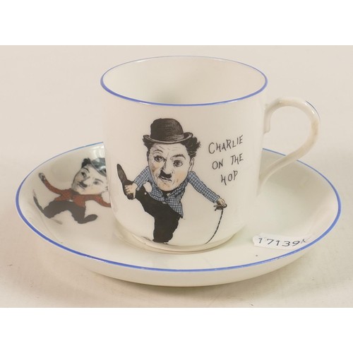 700 - Paragon China unusual cup & saucer decorated with comical Charlie Chaplin. (2)