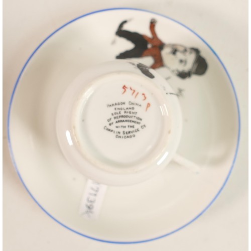 700 - Paragon China unusual cup & saucer decorated with comical Charlie Chaplin. (2)