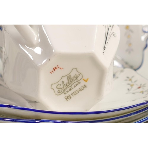 878 - Shelley Queen Anne shape tea set, pattern 11561, Blue Iris pattern. Consisting of 7 cups, 11 saucers... 