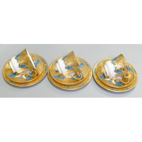 1008 - De Lamerie Fine Bone China heavily gilded Blue Royale patterned trios, specially made high end quali... 