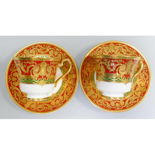 1009 - De Lamerie Fine Bone China heavily gilded Red/ Green Empress patterned cup / saucer sets, specially ... 