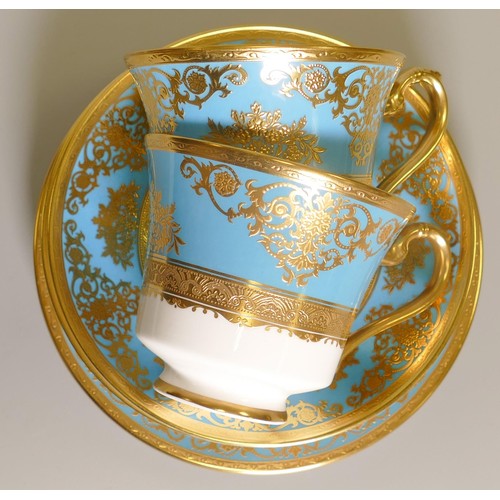 1018 - De Lamerie Fine Bone China heavily gilded Turquoise Exotic Garden patterned trios, specially made hi... 