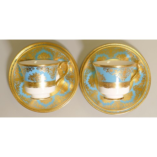 1018 - De Lamerie Fine Bone China heavily gilded Turquoise Exotic Garden patterned trios, specially made hi... 