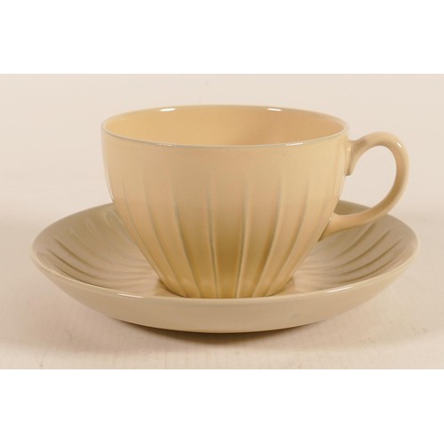 1101 - Wedgwood Norman Wilson ribbed tea cup & saucer, yellow / blue glaze, dated 1960.