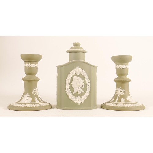 1110 - Wedgwood sage green candlesticks & tea caddy, height of tallest 16.5cm. (3)