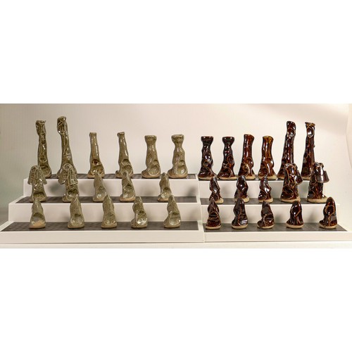 1556 - Two mid century studio pottery chess sets, 64 pieces, height of largest King 12.6cm.