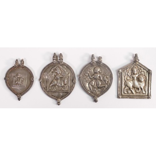 1867 - Four large Indian (or similar) silver pendants, late 19th / early 20th century.  Largest 72mm high, ... 