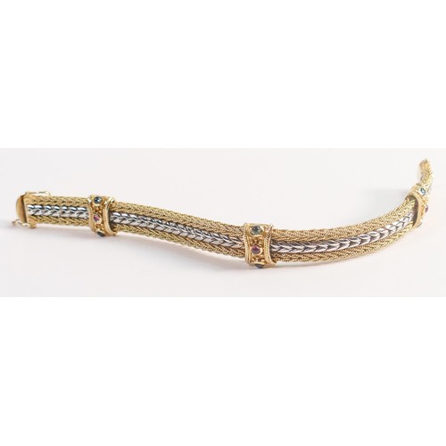 1922 - 14ct gold two colour bracelet, a heavy piece set with rubies and sapphires, gross weight 39.3g. In e... 