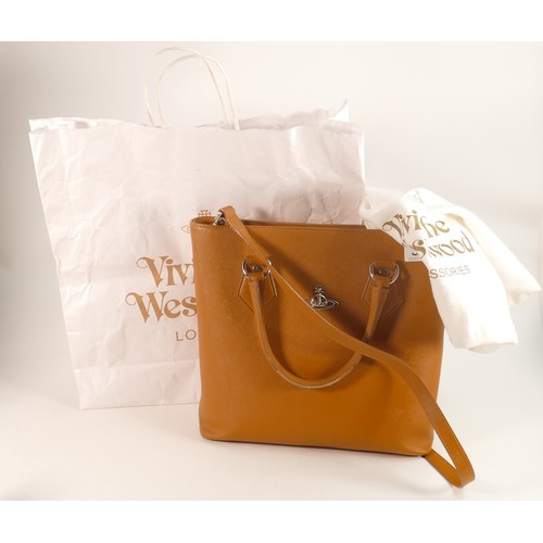 396 - Vivienne Westwood tan leather hand / shoulder bag with silver logo. Comes with original dust bag and... 