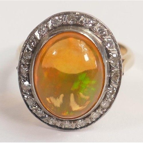 1963 - Yellow metal precious mexican fire opal ring set with diamonds, tested for 14ct gold, oval opal appr... 