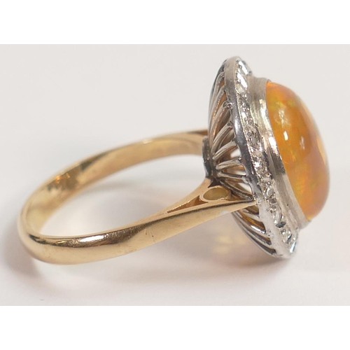 1963 - Yellow metal precious mexican fire opal ring set with diamonds, tested for 14ct gold, oval opal appr... 